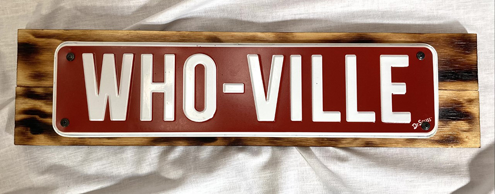 Red and white metal WHO-VILLE sign mounted on wood and ready to hang, 20″ x 5″-